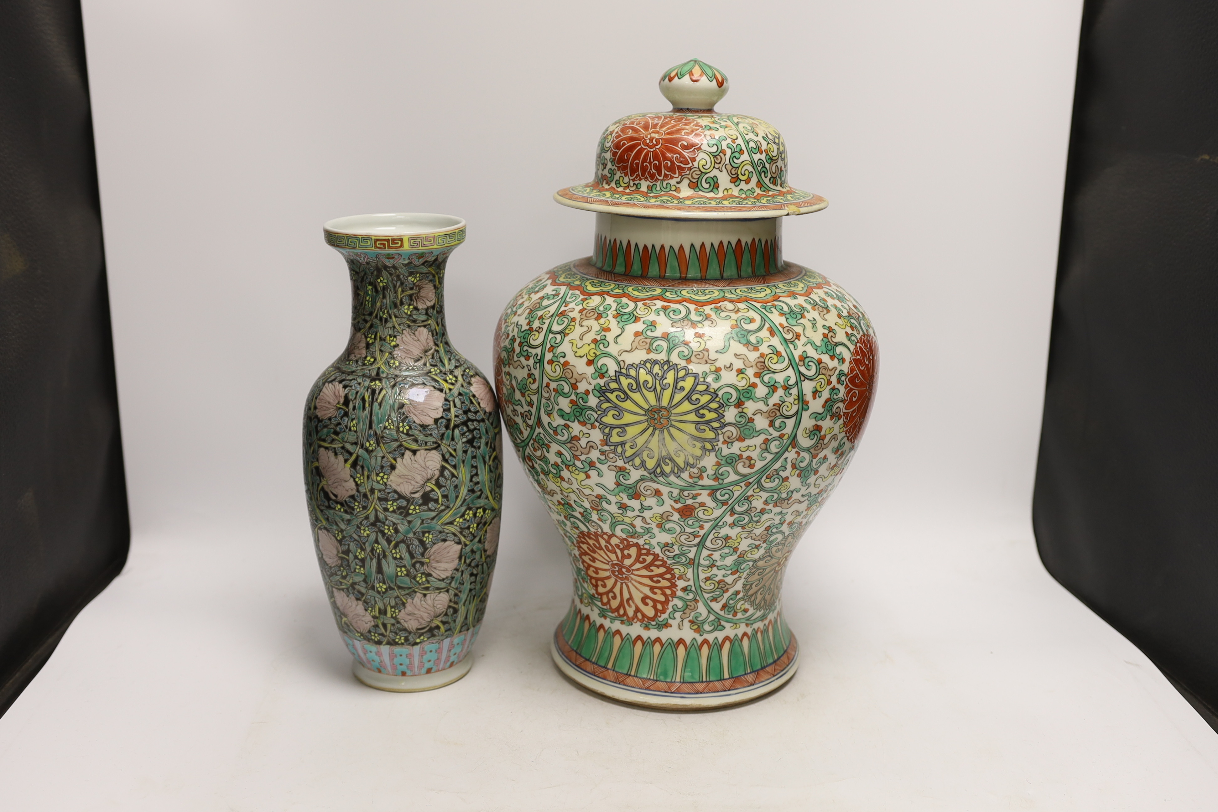 A large Chinese famille verte baluster jar and cover and a famille noir vase, tallest 40cm